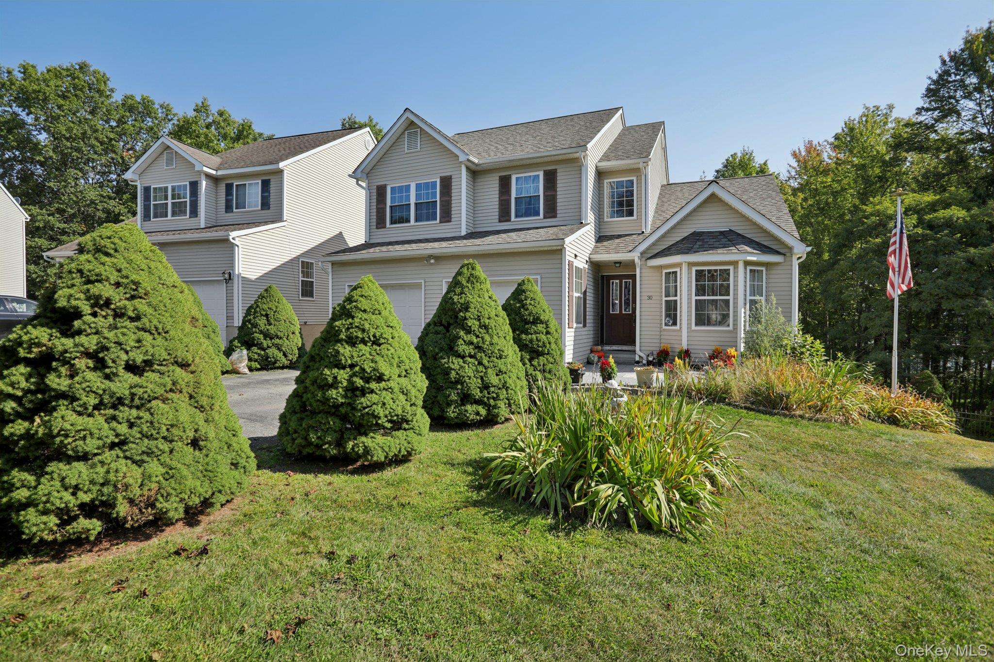 front view of a house with a yard