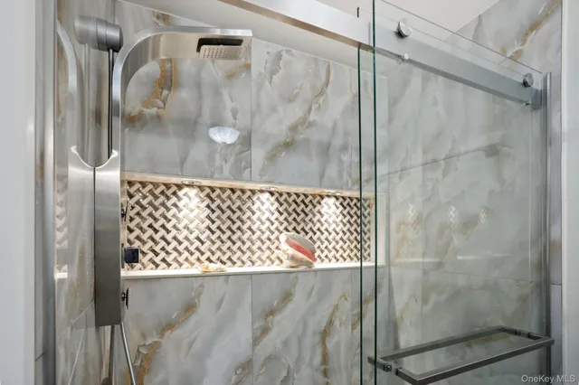 a living room with furniture and a painting on the wall