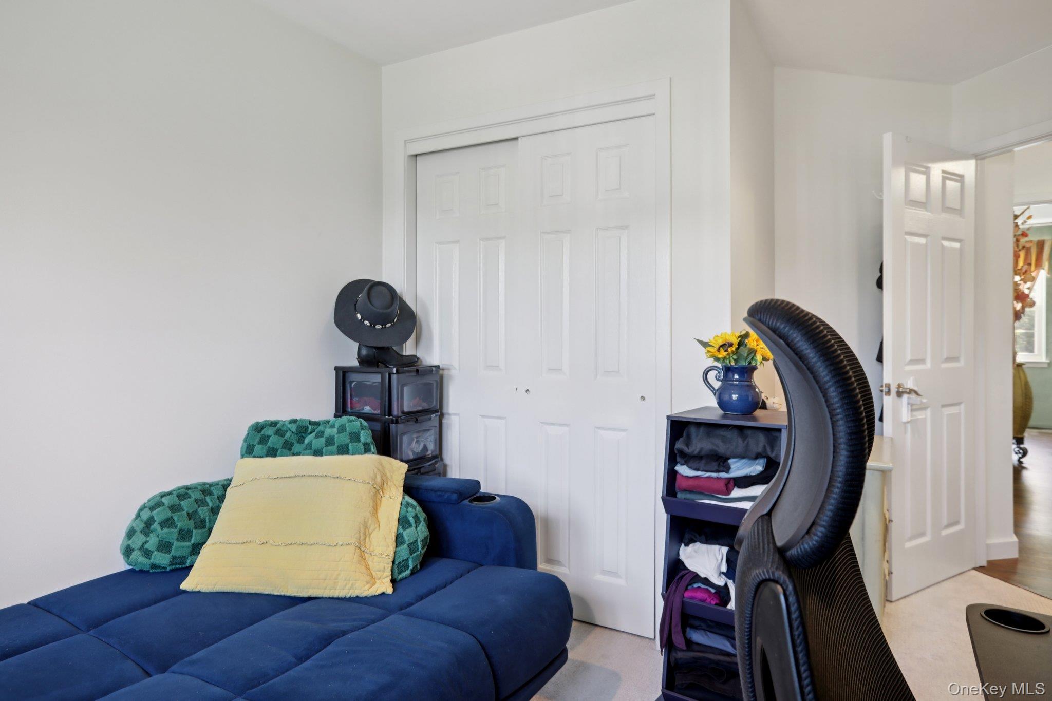 30 Reed Court Washingtonville, NY 10992 - Photo 17 of 36 a living room with furniture and a painting on the wall