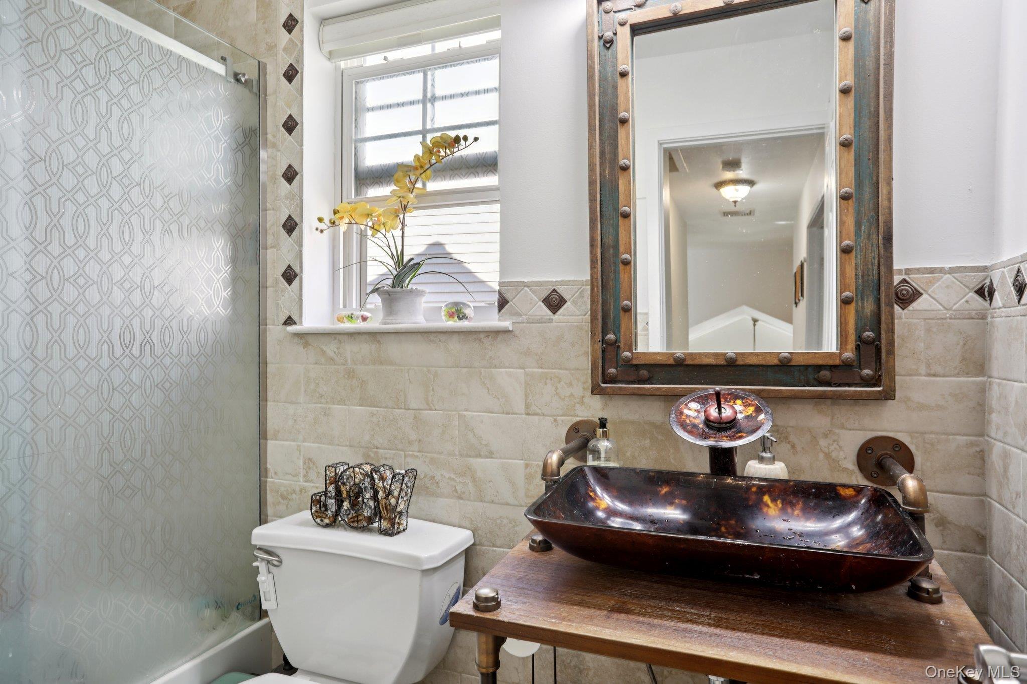 30 Reed Court Washingtonville, NY 10992 - Photo 19 of 36 a bathroom with a sink and a mirror with toilet