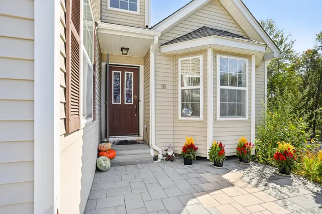 an entrance to house with yard