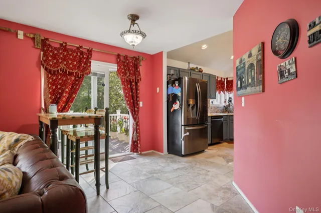 a view of a livingroom with furniture and entryway