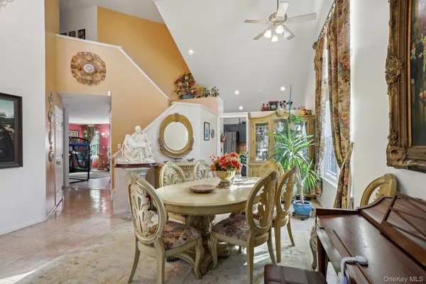 a dining room with furniture and wooden floor