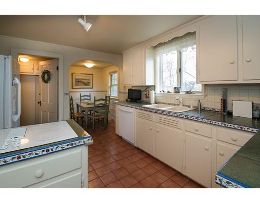 153 Walnut Hill Road Brookline, MA 02467 - Photo 5 of 9 a kitchen with sink cabinets and window