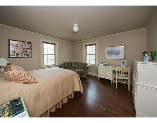 153 Walnut Hill Road Brookline, MA 02467 - Photo 7 of 9 a bed room with a bed and a chair
