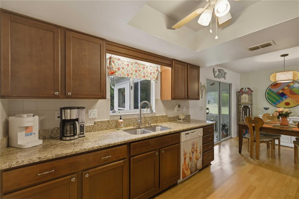 17577 Southeast 104th Circle Summerfield, FL 34491 - Photo 13 of 27 a kitchen with lots of counter space and a sink