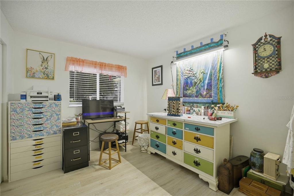 17577 Southeast 104th Circle Summerfield, FL 34491 - Photo 14 of 27 a view of a workspace with furniture and a window