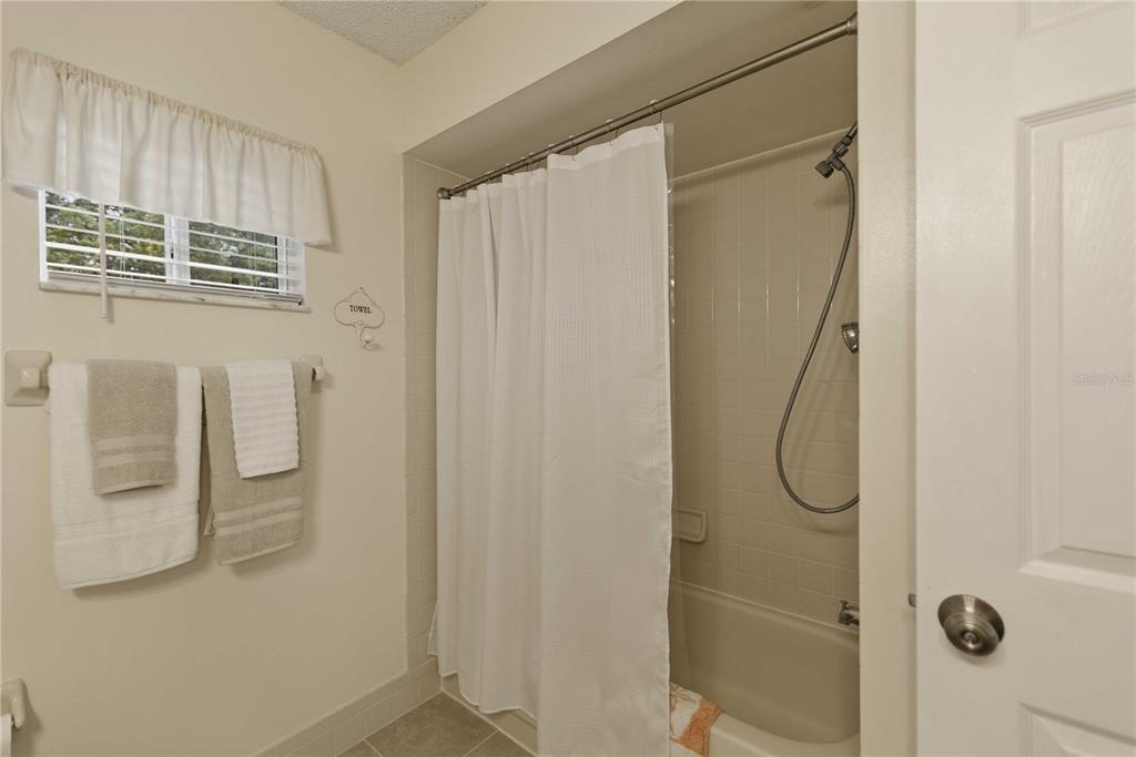 17577 Southeast 104th Circle Summerfield, FL 34491 - Photo 17 of 27 a bathroom with a shower