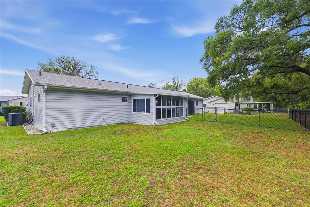 17577 Southeast 104th Circle Summerfield, FL 34491 - Photo 26 of 27 a view of a house with a backyard