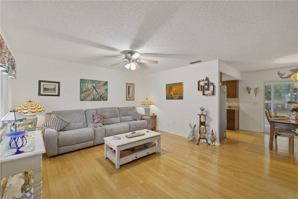 17577 Southeast 104th Circle Summerfield, FL 34491 - Photo 7 of 27 a living room with furniture and a table