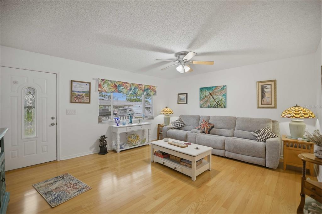 17577 Southeast 104th Circle Summerfield, FL 34491 - Photo 8 of 27 a living room with furniture and a flat screen tv