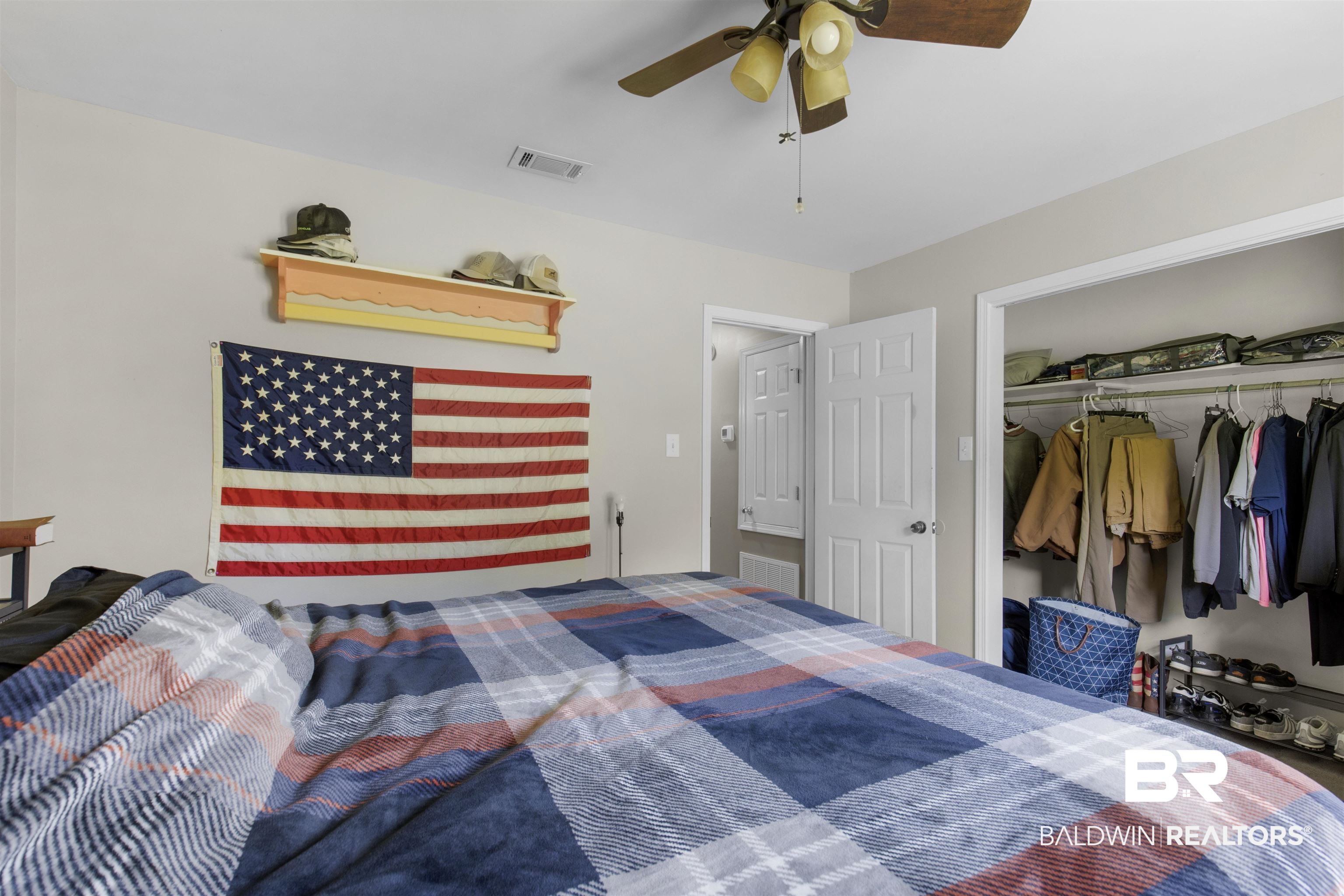 13925 Fort Lake Road Grand Bay, AL 36541 - Photo 17 of 37 Bedroom featuring ceiling fan, visible vents, and a closet