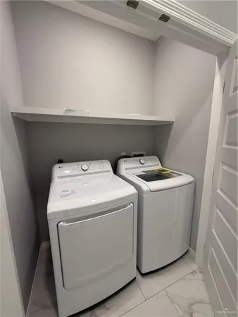 a utility room with dryer and washer
