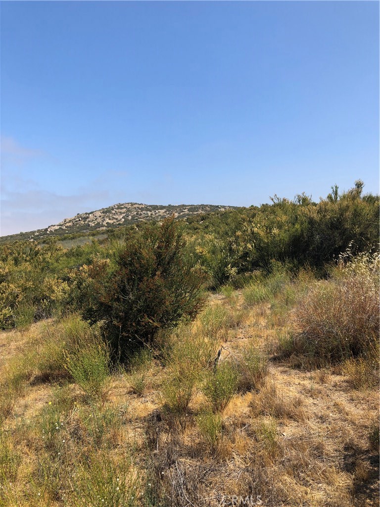 27 Rocky Knoll Road Hemet, CA 92544 - Photo 3 of 5 a view of lake with mountain