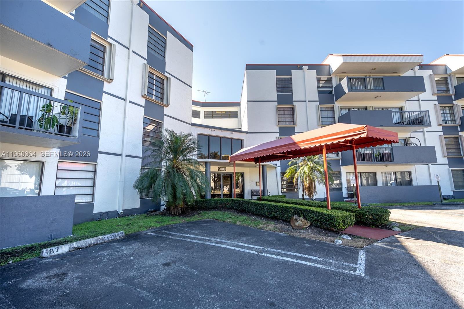 5800 Southwest 127th Avenue, Unit 2220 Miami, FL 33183 - Photo 11 of 36 a view of a building with a yard