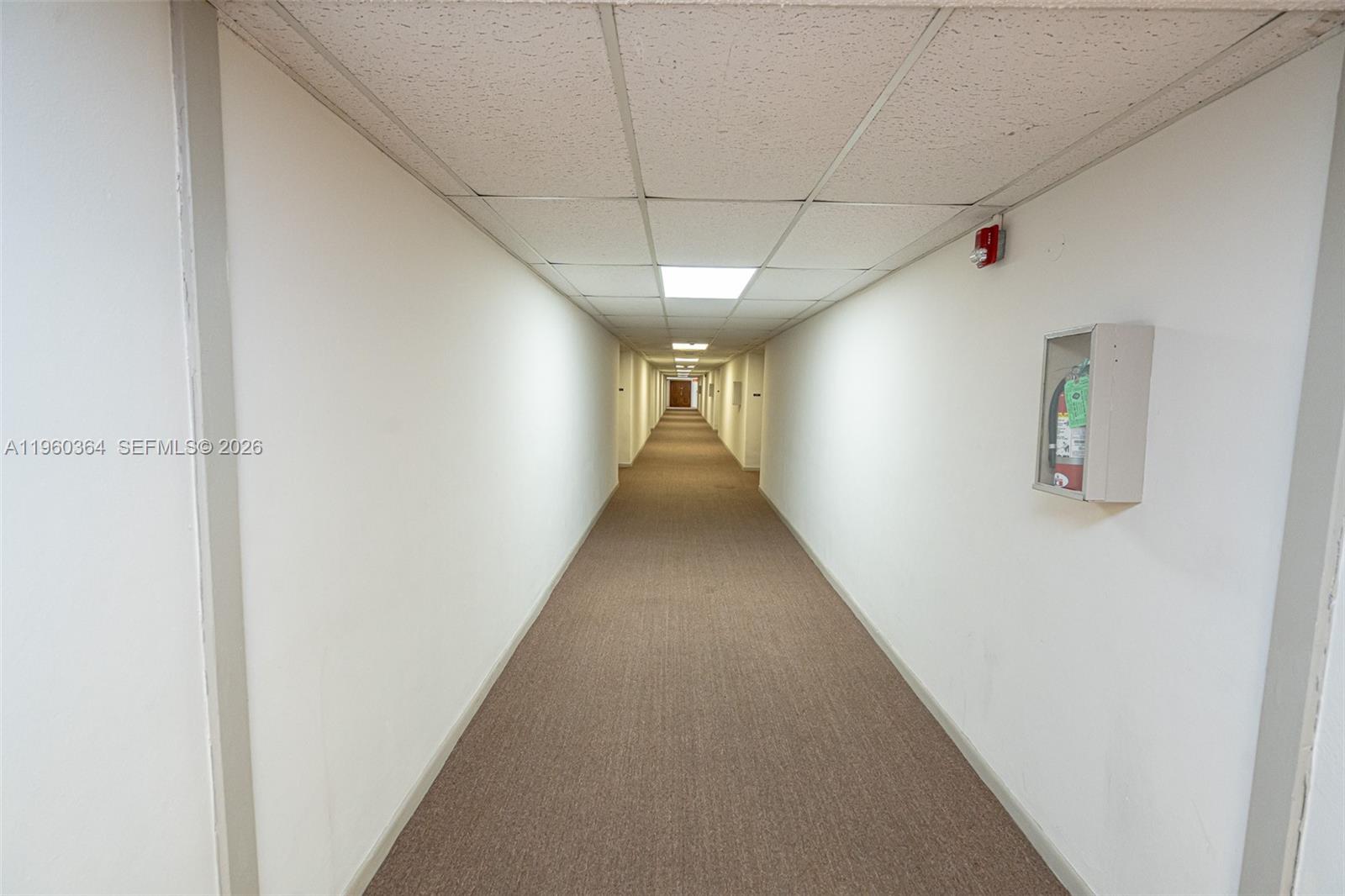 5800 Southwest 127th Avenue, Unit 2220 Miami, FL 33183 - Photo 16 of 36 a view of a hallway with a white walls