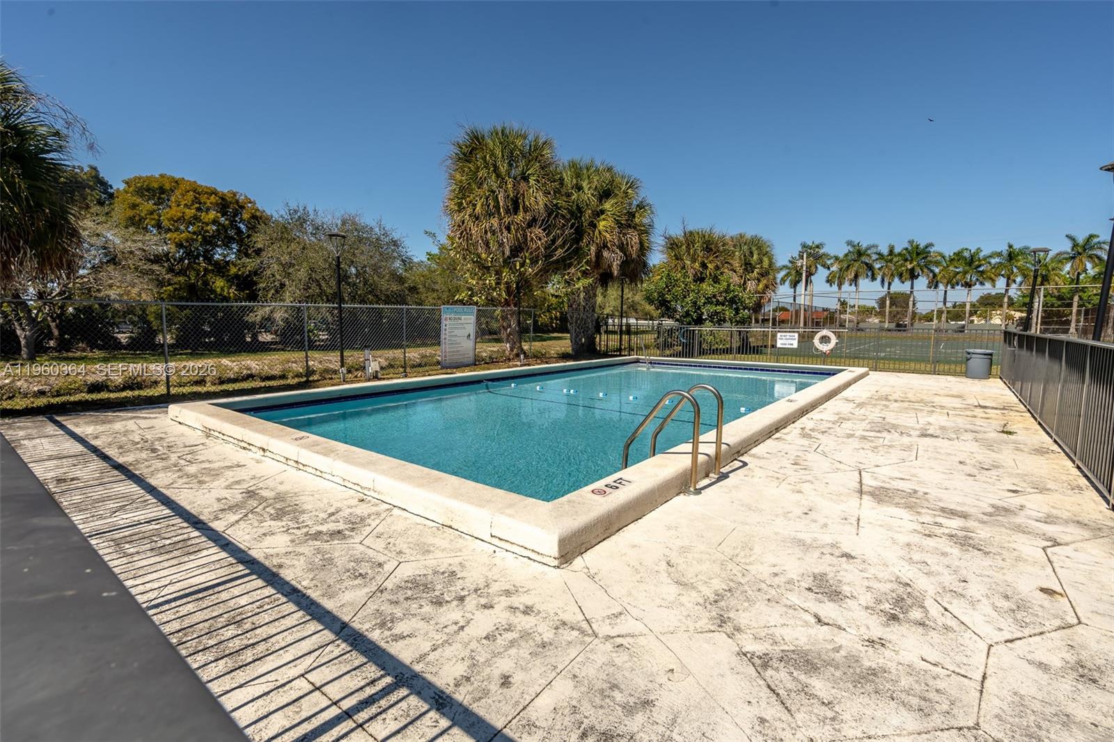 5800 Southwest 127th Avenue, Unit 2220 Miami, FL 33183 - Photo 22 of 36 a view of a swimming pool with a patio