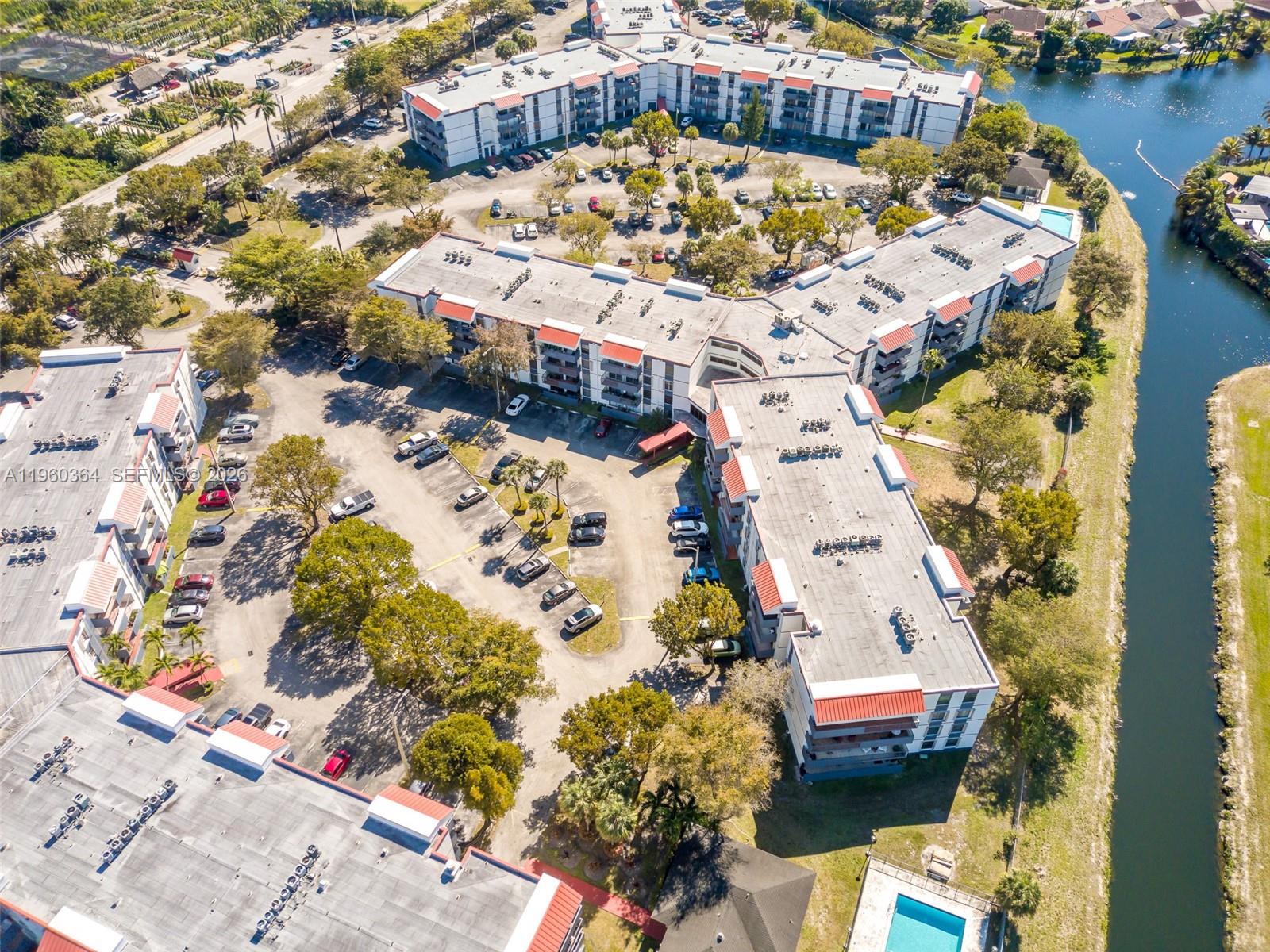 5800 Southwest 127th Avenue, Unit 2220 Miami, FL 33183 - Photo 30 of 36 an aerial view of residential houses with outdoor space