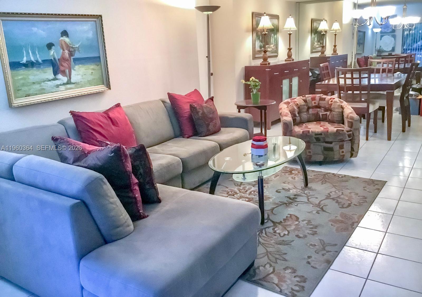 5800 Southwest 127th Avenue, Unit 2220 Miami, FL 33183 - Photo 3 of 36 a living room with furniture and a potted plant
