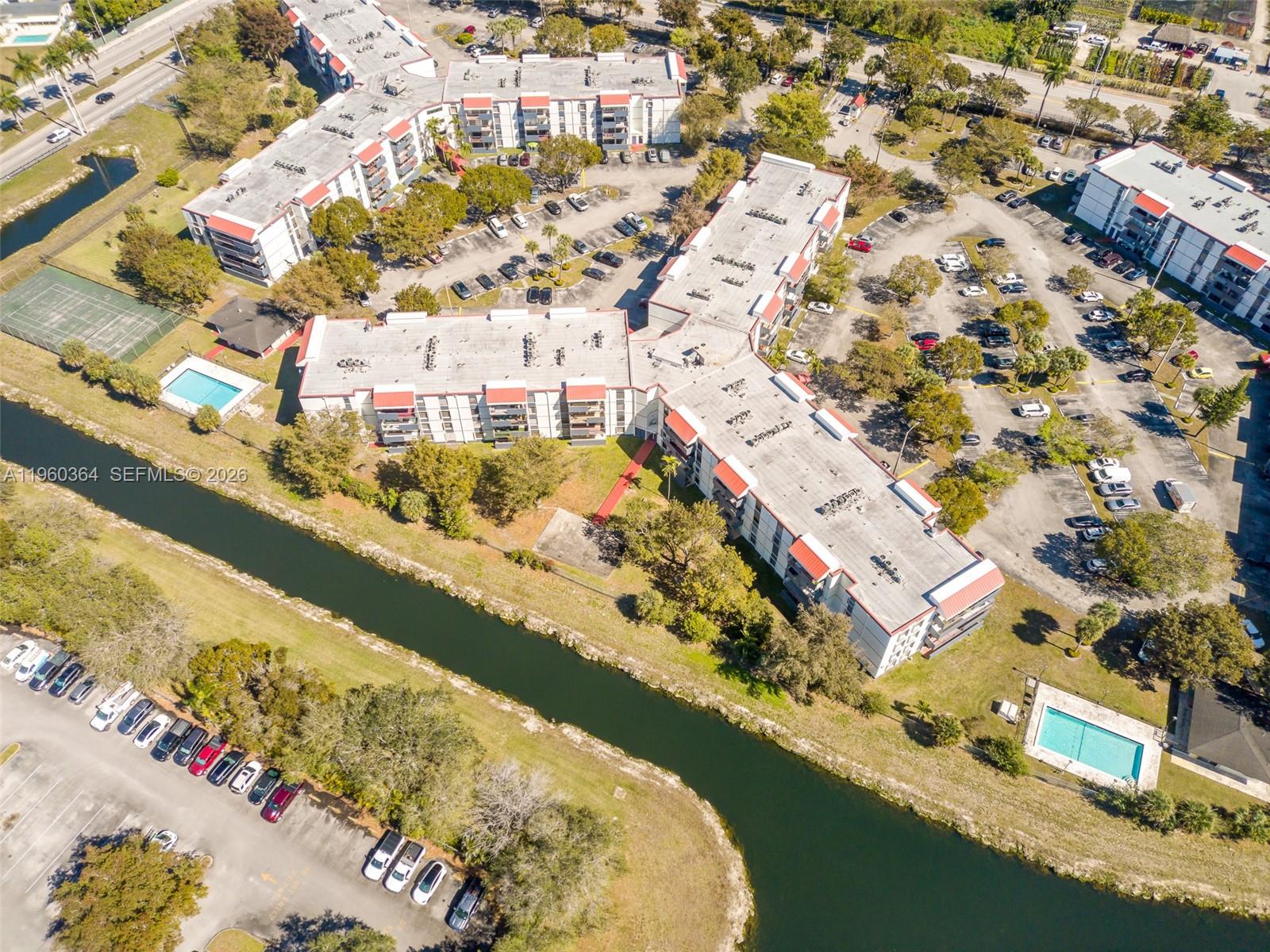 5800 Southwest 127th Avenue, Unit 2220 Miami, FL 33183 - Photo 33 of 36 an aerial view of residential houses with outdoor space