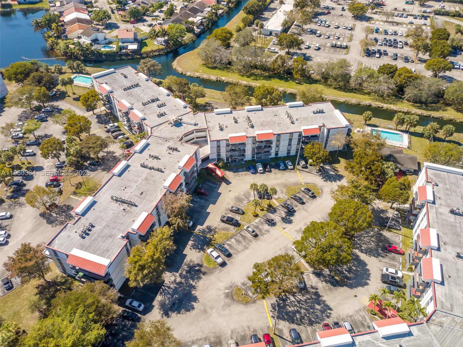 5800 Southwest 127th Avenue, Unit 2220 Miami, FL 33183 - Photo 35 of 36 an aerial view of residential houses with outdoor space