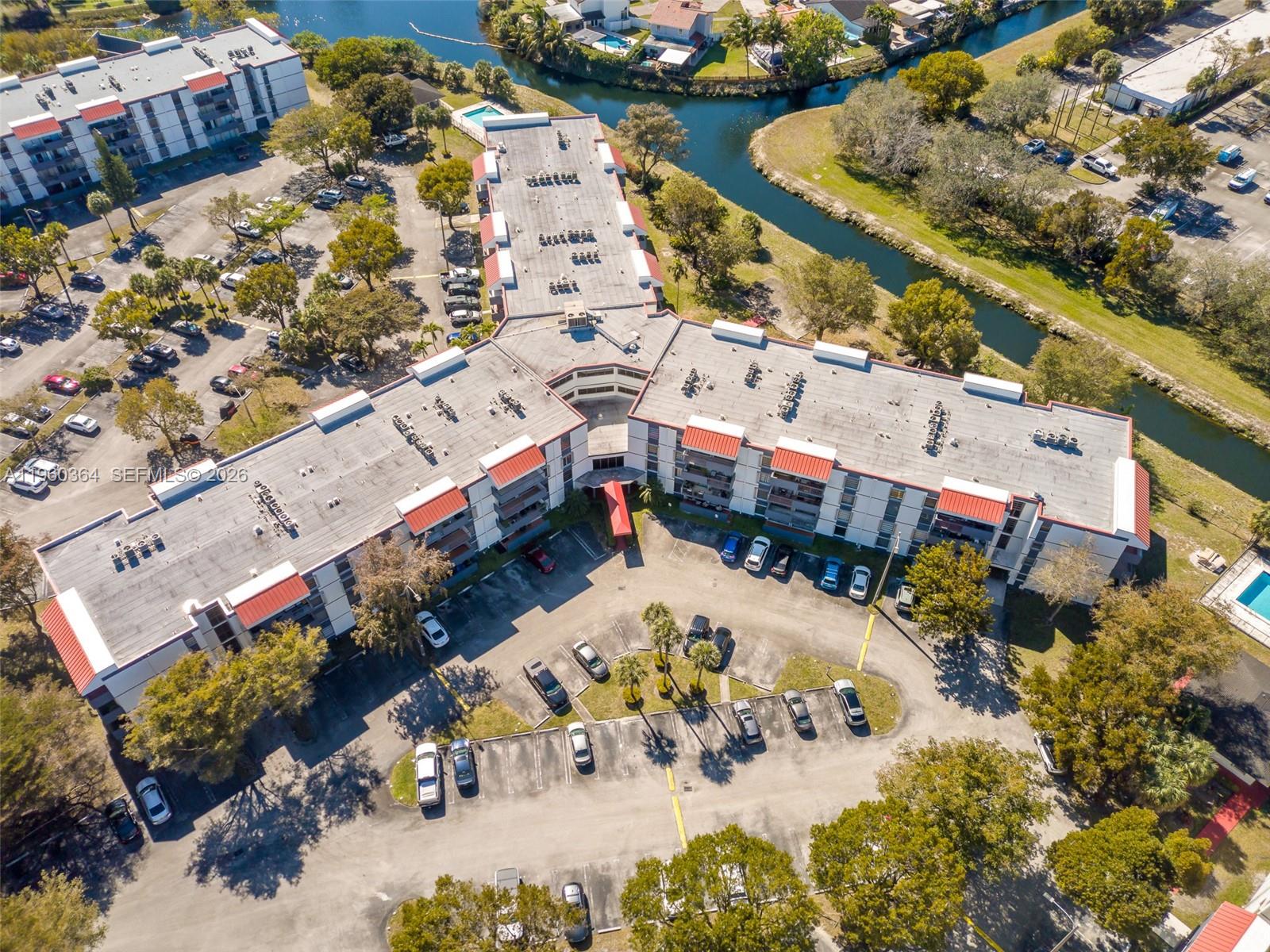 5800 Southwest 127th Avenue, Unit 2220 Miami, FL 33183 - Photo 36 of 36 an aerial view of a house with a yard and a large tree