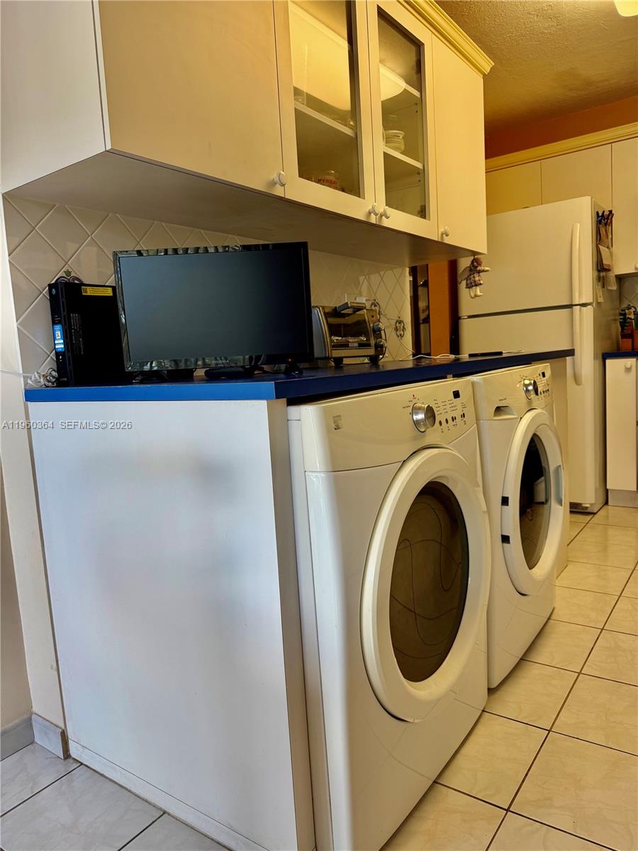 5800 Southwest 127th Avenue, Unit 2220 Miami, FL 33183 - Photo 6 of 36 a utility room with dryer and washer