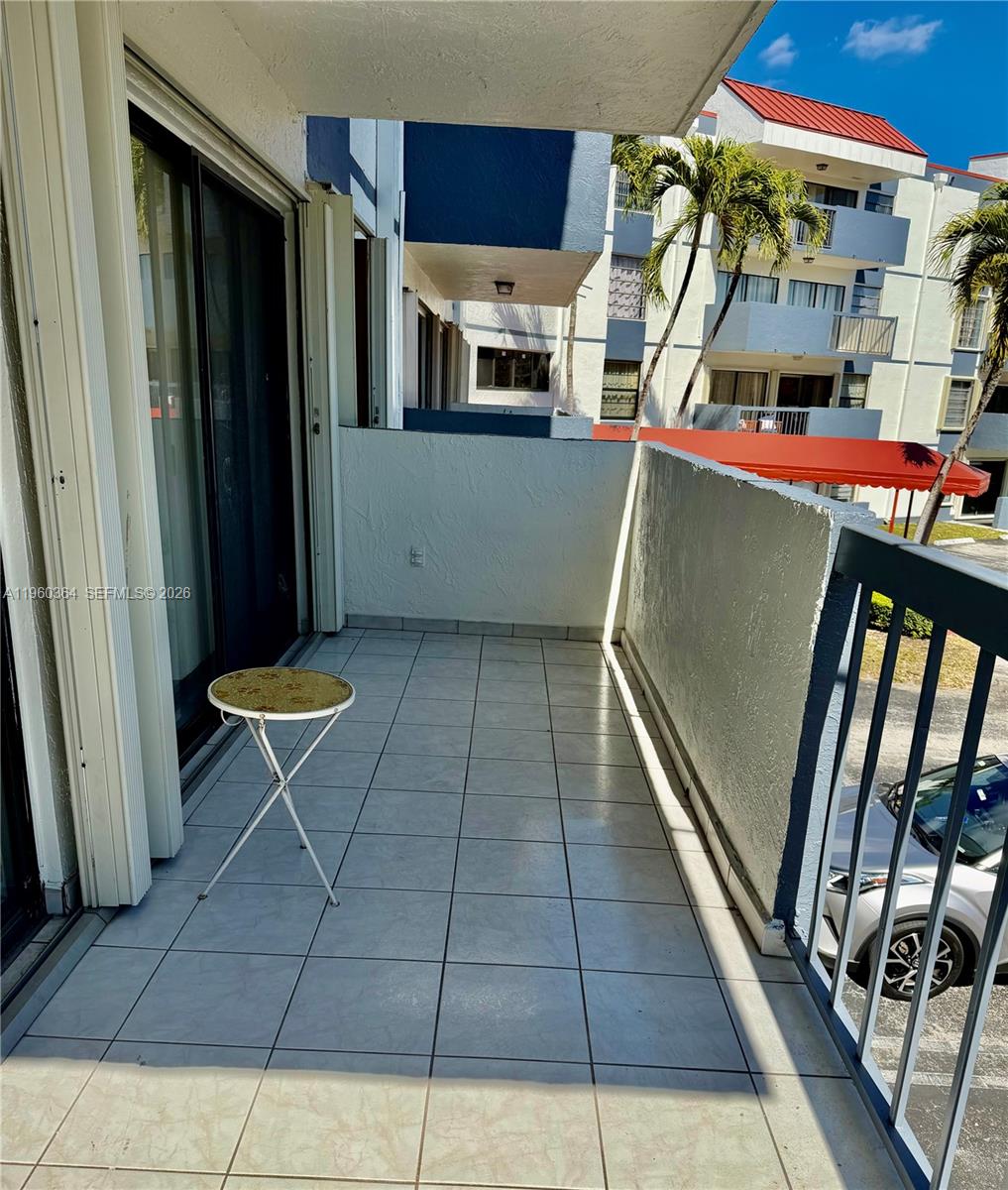 5800 Southwest 127th Avenue, Unit 2220 Miami, FL 33183 - Photo 7 of 36 a view of a patio with table and chairs