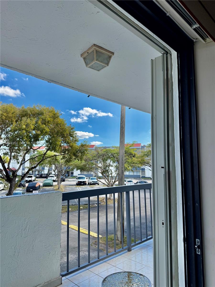 5800 Southwest 127th Avenue, Unit 2220 Miami, FL 33183 - Photo 8 of 36 a view of a balcony with an ocean view