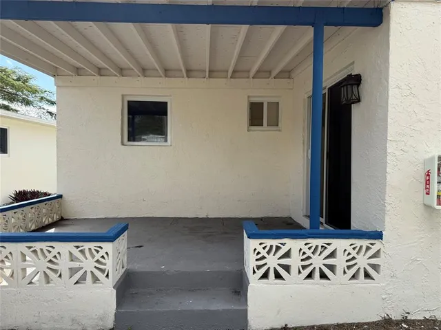 a view of a town with palm trees