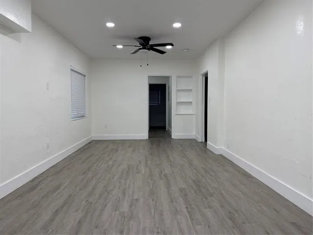 a kitchen with granite countertop a sink and a stove