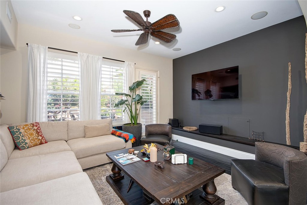 43 Carpenteria Irvine, CA 92602 - Photo 11 of 43 a living room with furniture and a flat screen tv