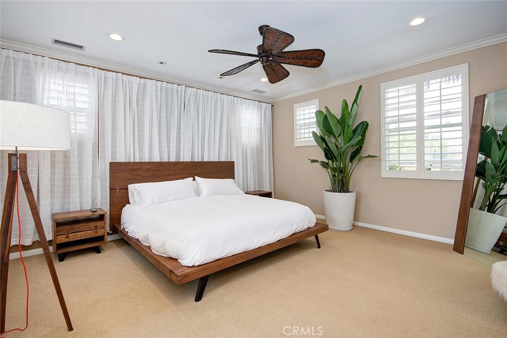 43 Carpenteria Irvine, CA 92602 - Photo 13 of 43 a bedroom with a large bed and a potted plant