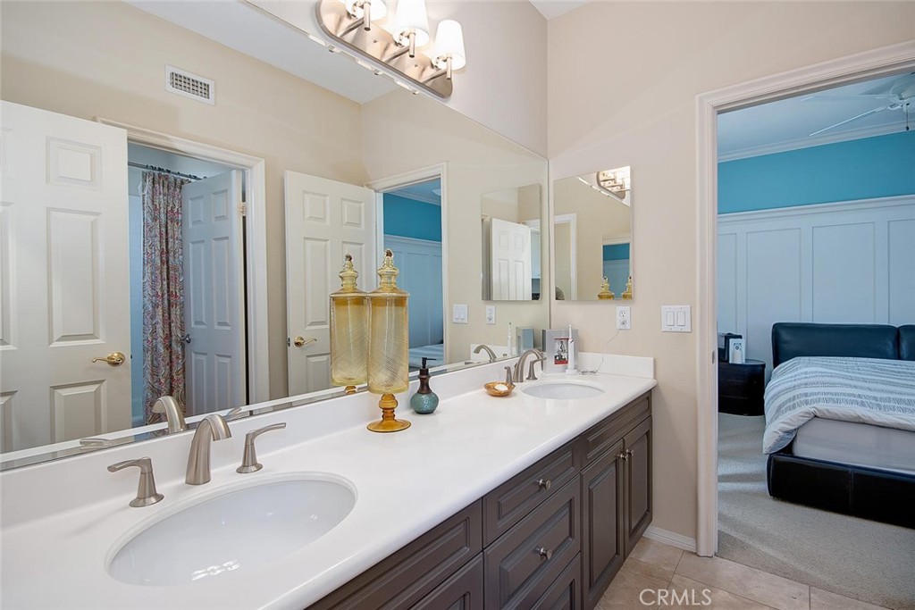 43 Carpenteria Irvine, CA 92602 - Photo 18 of 43 a bathroom with a sink double vanity and a mirror