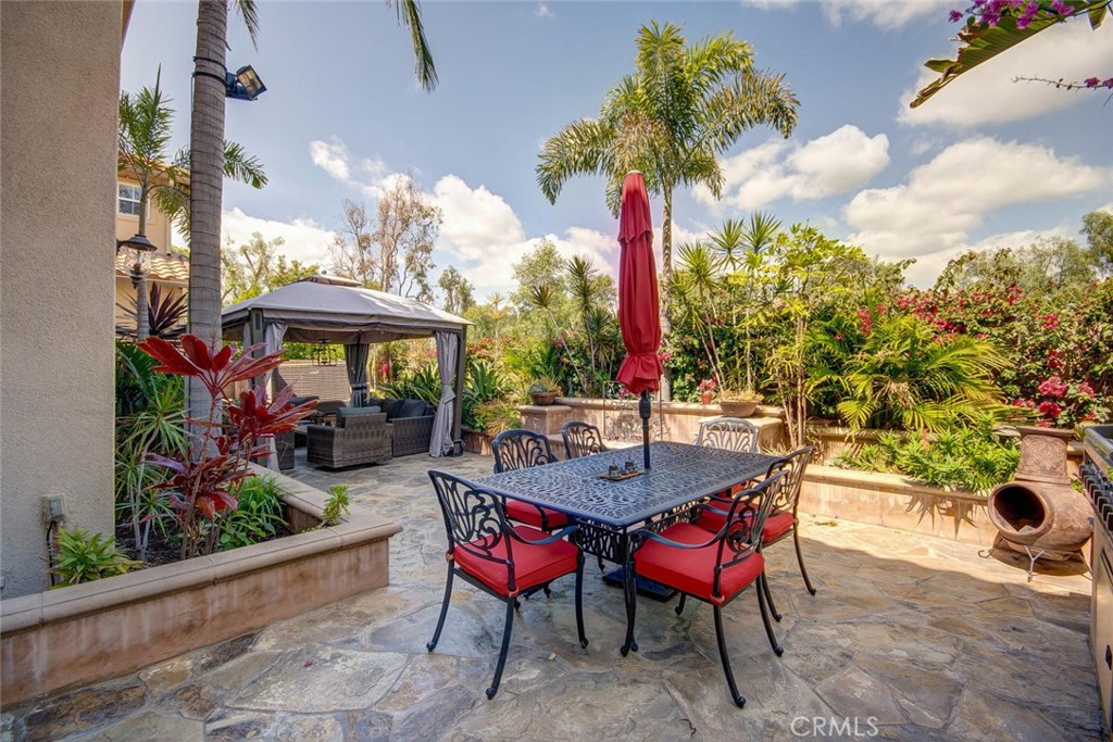 43 Carpenteria Irvine, CA 92602 - Photo 23 of 43 a view of a patio with a table and chairs under an umbrella