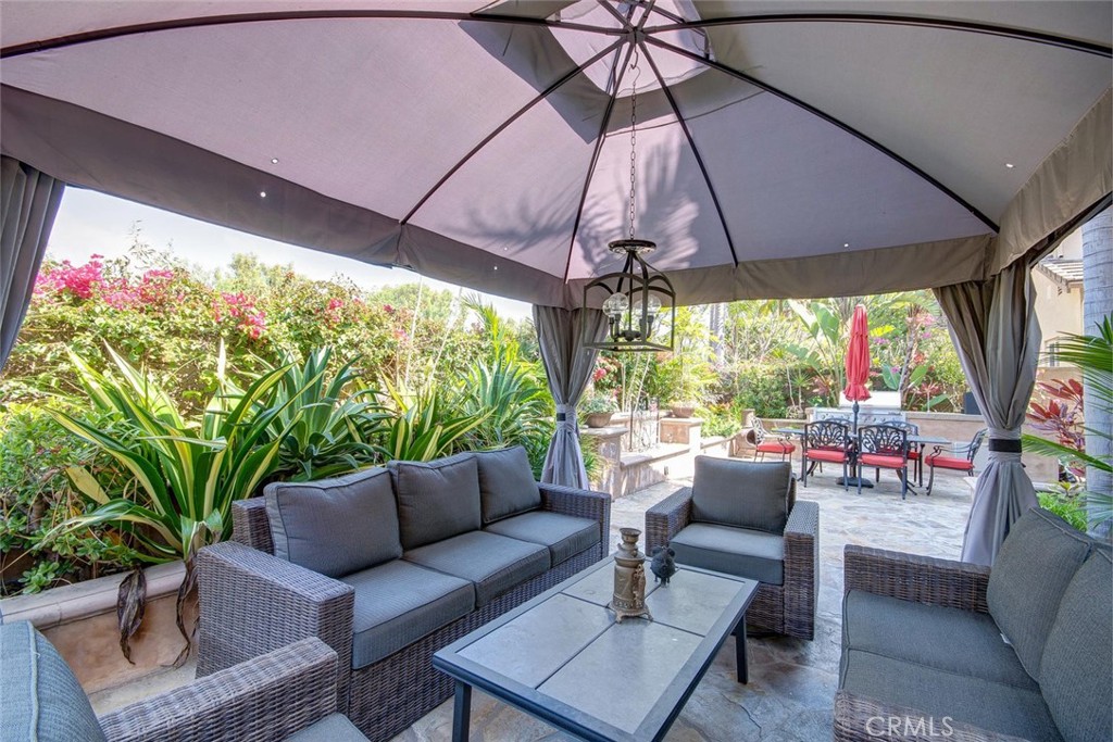 43 Carpenteria Irvine, CA 92602 - Photo 28 of 43 a outdoor living space with furniture and umbrella