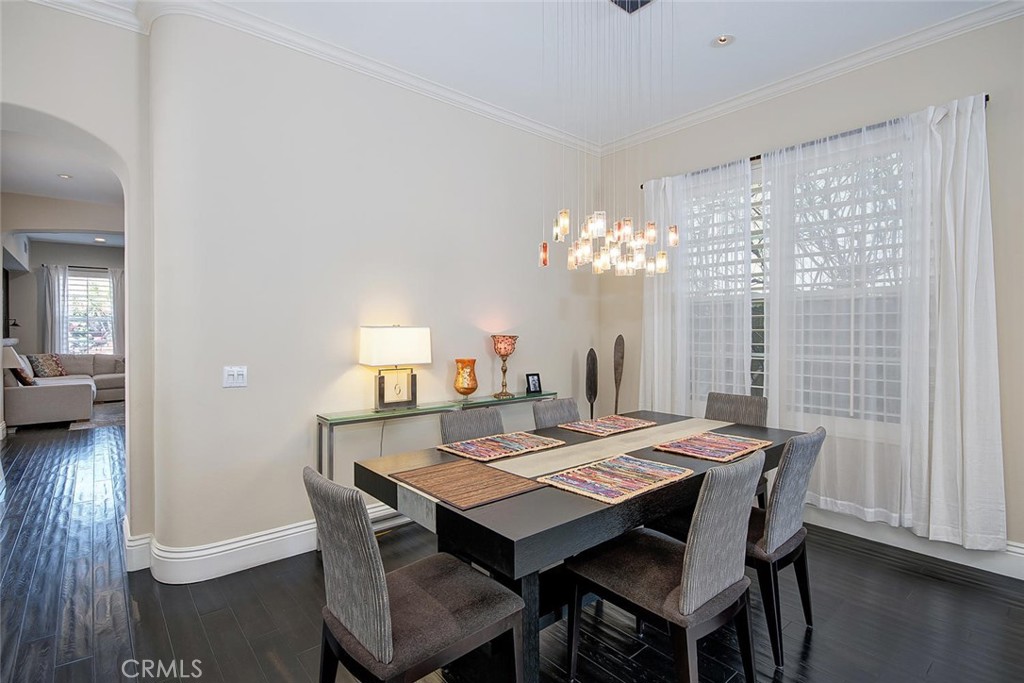 43 Carpenteria Irvine, CA 92602 - Photo 9 of 43 a view of a dining room with furniture and wooden floor