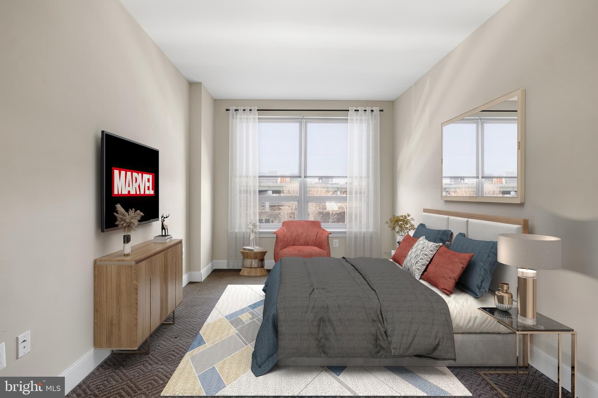 235 North Christopher Columbus Boulevard, Unit 914 Philadelphia, PA 19106 - Photo 25 of 56 a bedroom with a bed and a flat screen tv