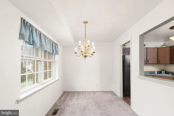 a kitchen with stainless steel appliances granite countertop a stove a refrigerator and a sink