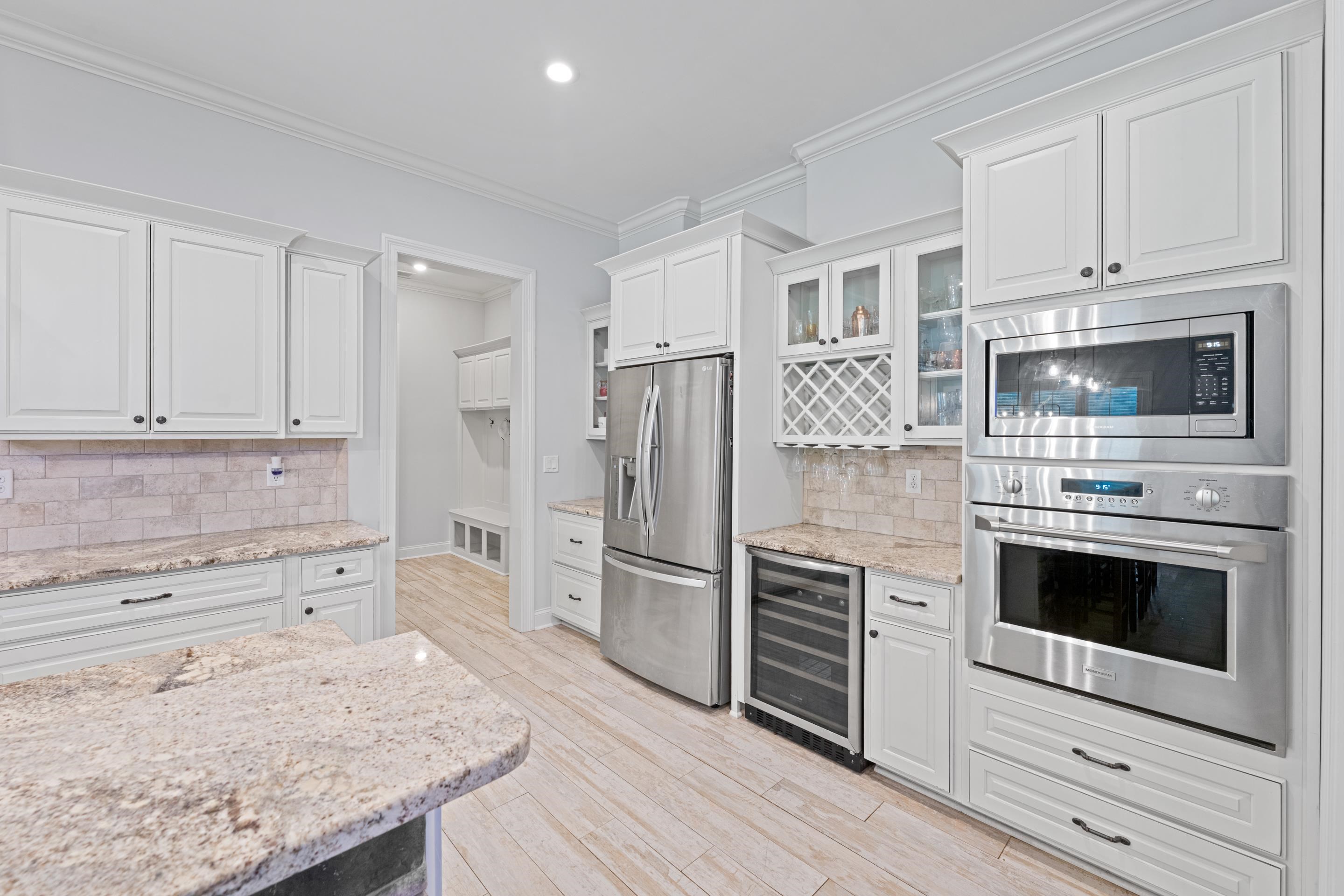 10354 Pleasant Ridge Road Arlington, TN 38002 - Photo 10 of 40 Designed with both beauty and convenience in mind, the kitchen offers two ovens, a built-in wine fridge, glass-front cabinetry, and plenty of storage for effortless entertaining.