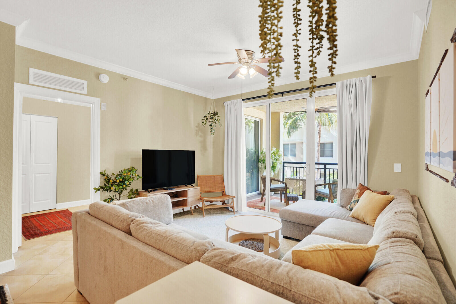 1201 Renaissance Way, Unit 201 Boynton Beach, FL 33426 - Photo 12 of 29 a living room with furniture and a flat screen tv