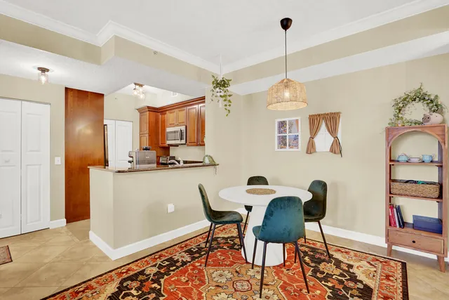a dining room with furniture and window