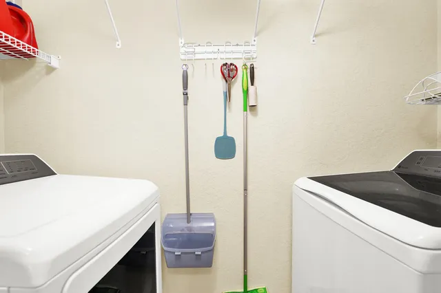 a utility room with dryer and washer