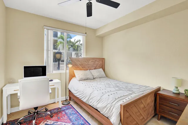 a bedroom with a bed and a flat tv screen