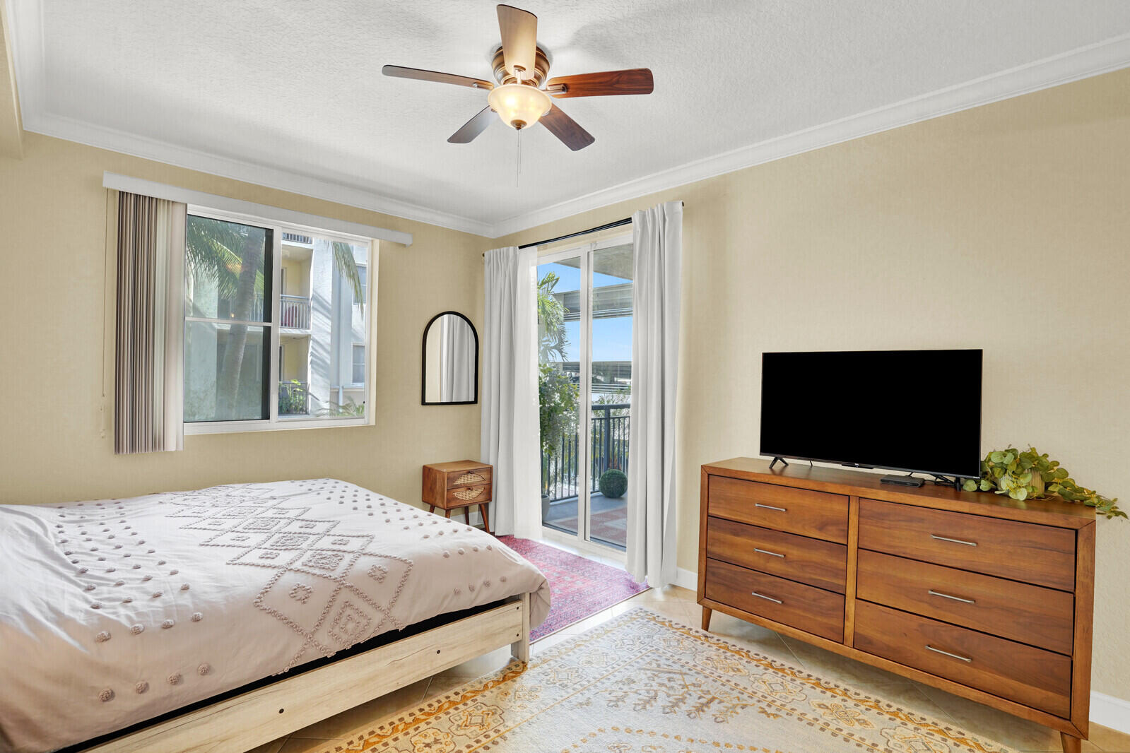 1201 Renaissance Way, Unit 201 Boynton Beach, FL 33426 - Photo 23 of 29 a bedroom with a bed and a flat screen tv