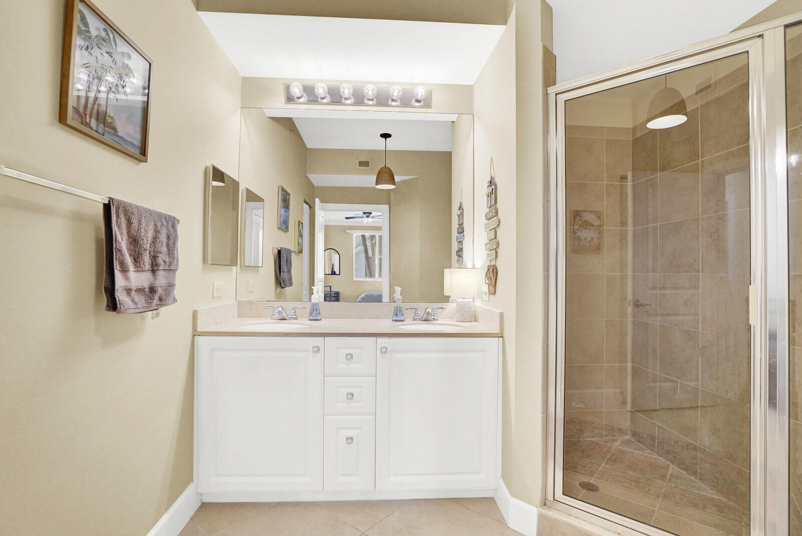 1201 Renaissance Way, Unit 201 Boynton Beach, FL 33426 - Photo 26 of 29 a bathroom with a granite countertop sink a mirror and a shower
