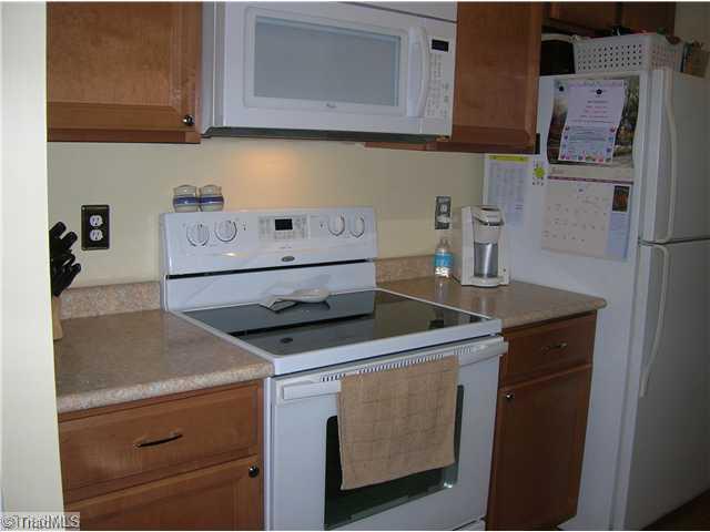 5105 Amberhill Drive Greensboro, NC 27455 - Photo 3 of 11 Kitchen. This wonderful kitchen has had some wonderful updates; such as new maple cabinets, new countertops, new appliances, new laminate flooring