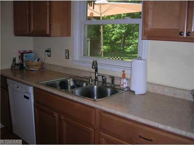 5105 Amberhill Drive Greensboro, NC 27455 - Photo 4 of 11 Kitchen. Another view of the kitchen shows the ss sinks, new dishwasher and you have a window over the sink!