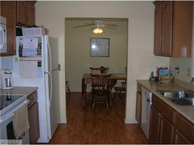 5105 Amberhill Drive Greensboro, NC 27455 - Photo 5 of 11 Kitchen. Another great shot of the kitchen shows that the space is open to the dining area!