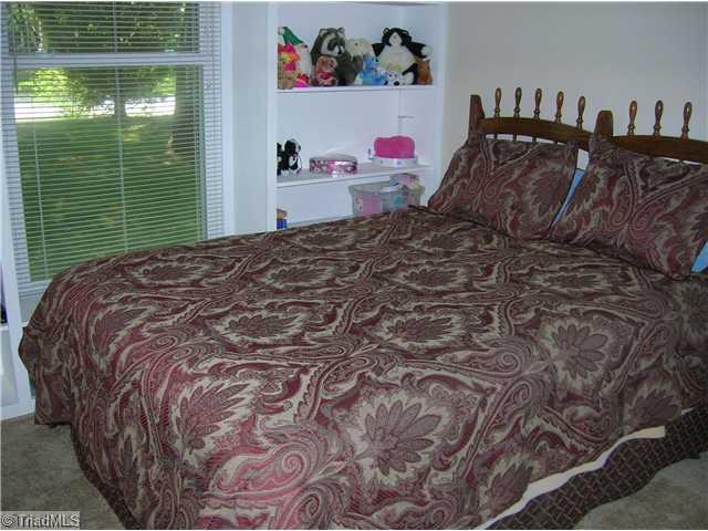 5105 Amberhill Drive Greensboro, NC 27455 - Photo 8 of 11 2nd Bedroom. The 2nd bedrooom has lot s of light and built in shelves!
